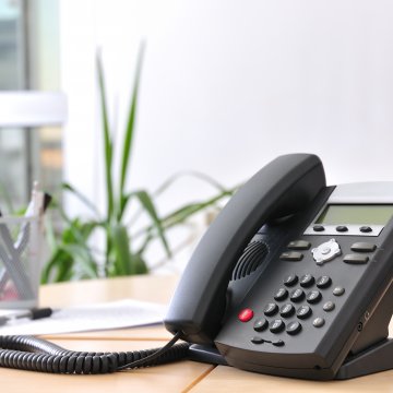 axvoice review voip service voip phone in office on desk 